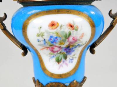 A 19thC continental porcelain garniture vase, of inverted baluster form, with gilt metal mounts, Sevres porcelain plaques, a floral finial, pierced handles and acanthus leaf stem, on a rectangular base terminating in compressed orb feet, 29cm H. - 3