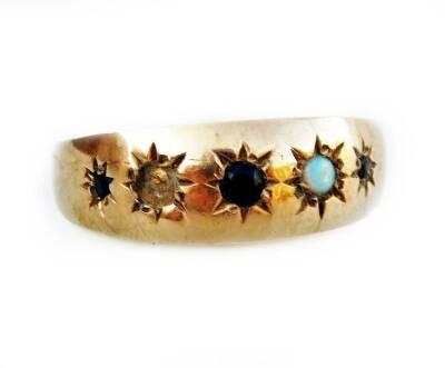 A Victorian 9ct gold gypsy ring, set with five illusion star set stones, including opals and sapphires (1 opal missing), 2.6g all in.