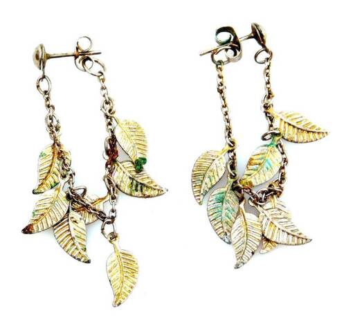 A pair of silver leaf drop earrings, each earring with seven leaf drops, on chain, with butterfly backs, 4.1g.