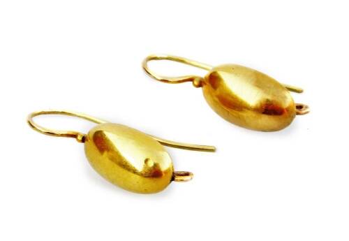 A pair of hoop earrings, of oval drop design, with clips possibly for attachment, yellow metal unmarked, 1.5g all in.