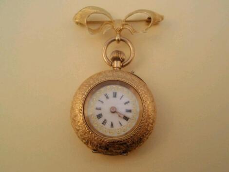 A ladies fob watch on bow brooch pin