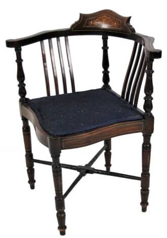 An Edwardian mahogany and partially painted corner chair, on turned legs joined by an X stretcher, with overstuffed seat in blue material, 74cm H.