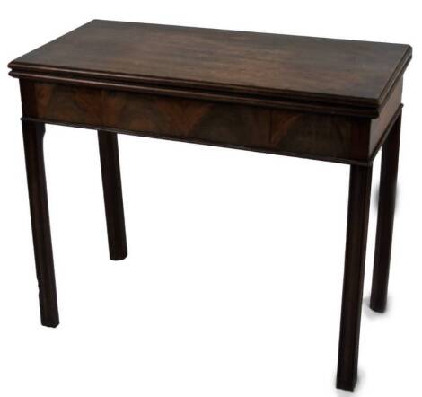 An early 19thC mahogany fold over tea table, of rectangular form, on square legs, when closed 76cm H, 91cm W, 44cm D.