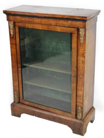 A 19thC walnut and inlaid pier cabinet, the rectangular overrun top raised above a glazed door, flanked by gilt metal acanthus leaf additions, with a fitted interior, on block base, 106cm H, 75cm W, 31cm D.