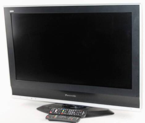 A Panasonic DVB Viera 32 inch colour television, in black and silver trim, with two remote controls and wire.