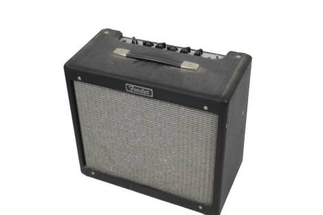 A Fender amplifier, with meshwork front, in case, 42cm H, tripod stand, etc. (a quantity)