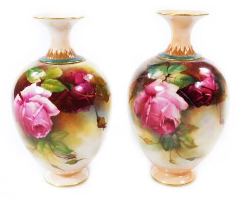 A pair of late 19thC Royal Worcester vases, decorated by Reginald Austin, c.1899, each handpainted with roses, signed R Austin, with compressed trumpet stems, bulbous bodies and circular feet, green printed marks, 19cm H. (2, AF)