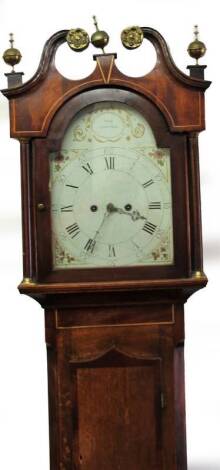 An early 19thC oak and mahogany longcase clock by John Wood, Grantham, with swan neck pillared hood containing a 30cm W painted and signed arched dial with floral spandrels and Roman and Arabic numerals, 8-day movement striking a bell, above a short moul