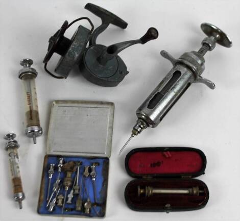 Bygones, collectables, etc., a veterinary spoon, unmarked, 13cm W, a veterinary style syringe, chrome plated with articulated plunger top, 19cm H, K R Morritt fishing reel, cased syringe and other scientific instruments, etc. (a quantity)