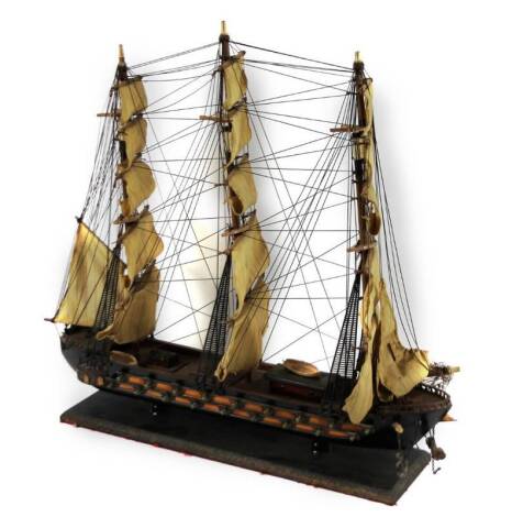 A 20thC model ship, the Frigate Espanola Sigol XVI with realistic deck and rigging, on an ebonised base, 58cm H, 66cm W, 19cm D.