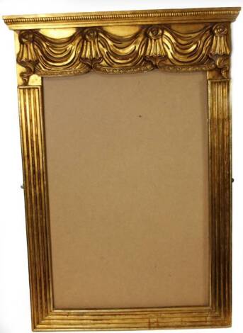 A 20thC gilt wood frame, with dentil top, bellflower and scroll moulding, 119cm H, 83cm W, 7cm D.