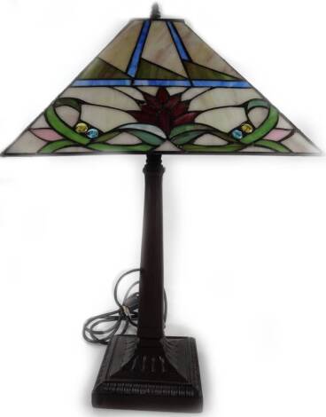 An as new table lamp, with Tiffany style shade in floral pattern, predominately in red, cream and green, 62cm H.