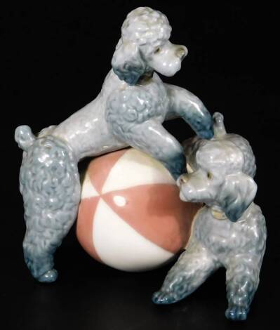 A Lladro figure group, of two poodles playing with a beach ball, 14cm H.