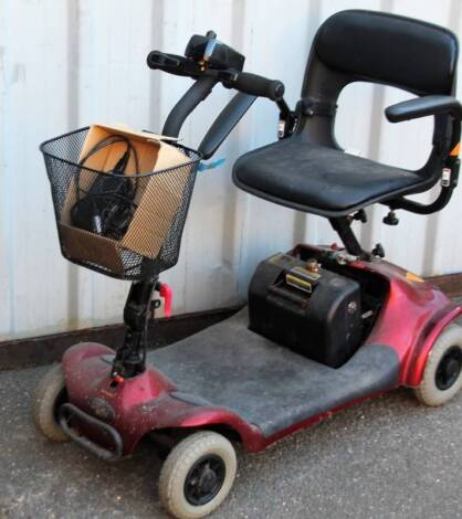 A Euro electric four wheel mobility scooter, in red trim, with front basket, 91cm H, with charger.