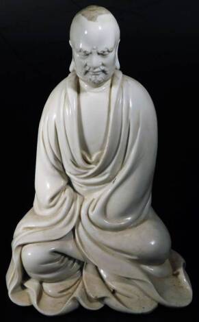 A Chinese blanc de chine figure, of seated gentleman in flowing robes, 24cm H. (hollow)