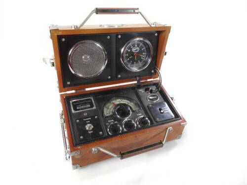 A Spirit of St. Louis radio alarm clock, in the form of a receiver