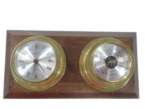 An Anstey Wilson hanging quartz clock and barometer, each in circular cases with 9cm Dia. Roman numeric dial, etc.