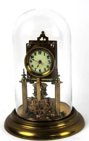 A early 20thC brass anniversary clock, the 6cm Dia. dial revealing an exposed pendulum driven movement, under a domed case, on circular base, 34cm H.