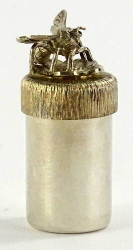 A Stuart Devlin silver pill box, of cylindrical form, the textured finish lid mounted with a bee, London 1982. ½oz, 4cm H.