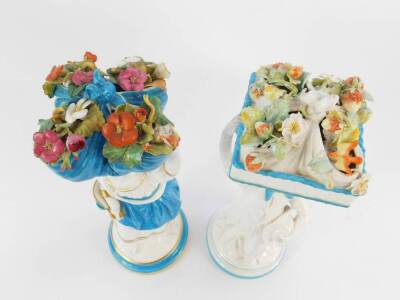 Two late 19thC Brownfield porcelain figures of a girl and boy, each modelled standing, the girl holding a folded cloth of flowers on her head, the boy holding a basket containing a folded cloth of strawberries and a bird on his head, raised on circular ba - 2