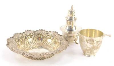 A Victorian silver sweetmeat dish, with embossed foliate decoration, Fenton Brothers Ltd, Sheffield 1901, together with a George V baluster pepper pot, Birmingham 1919, and a quaich type twin handled cup, initial engraved, London 1921, 3.73oz.