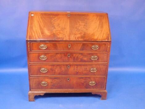 A George III mahogany and flame veneered bureau