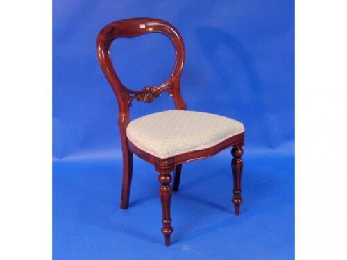 A set of six Victorian style mahogany balloon back dining chairs