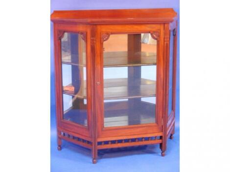 A fine late Victorian aesthetic movement display cabinet with single door