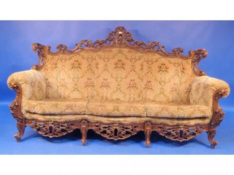 A Continental three seater sofa in Louis XV style and later upholstered