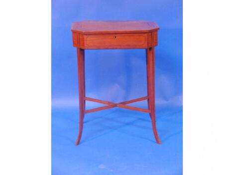 A 19thC satinwood work table with canted rectangular and cross banded top