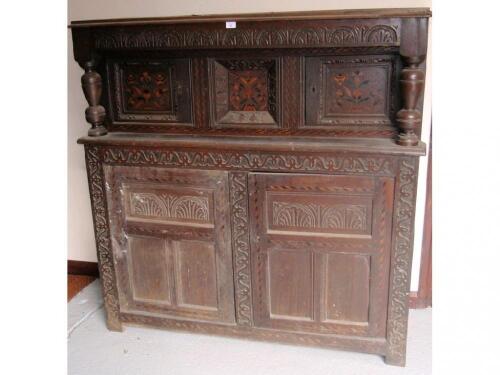 A 17thC and later oak court cupboard with chevron banding and floral marquetry