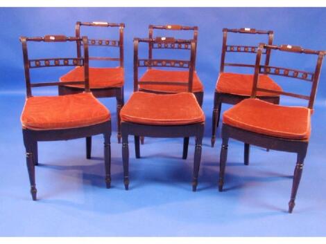 A set of six Regency mahogany dining chairs with bar and roundel backs