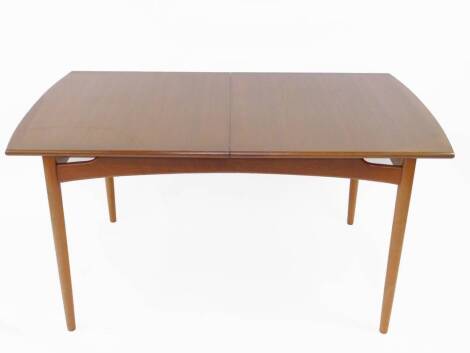 A 1960's G-Plan teak draw leaf dining table, with one additional leaf, raised on turned legs, 74cm H, 192cm W (including leaf), 89cm D.