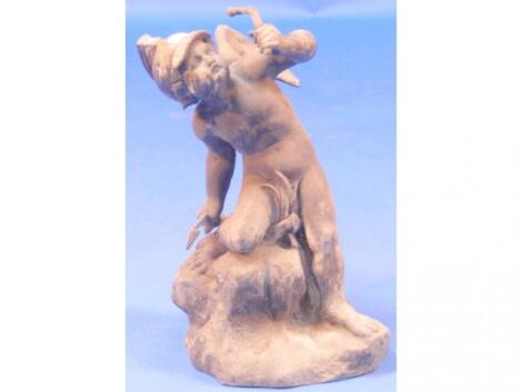 A 19thC lead figure of Cupid on a rocky outcrop