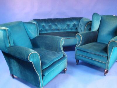 A late Victorian three piece suite comprising a matched configuration of - 3