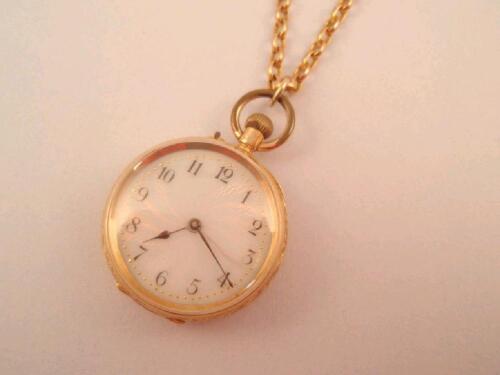 An 18ct gold cased fob watch on a belcher chain stamped 9ct