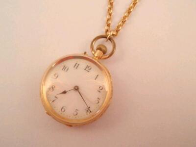 An 18ct gold cased fob watch on a belcher chain stamped 9ct