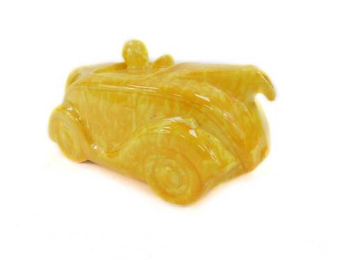 A Sadler yellow glazed pottery motor car teapot, impressed marks.