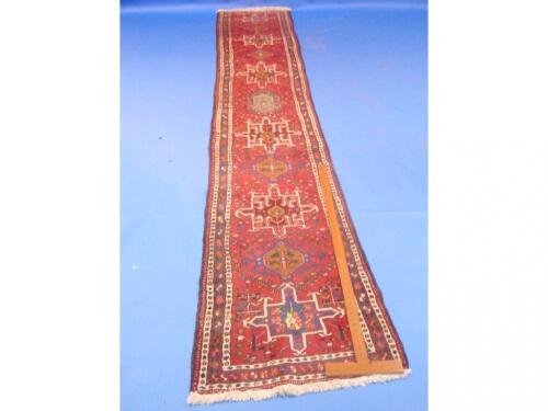 A red ground Turkish runner