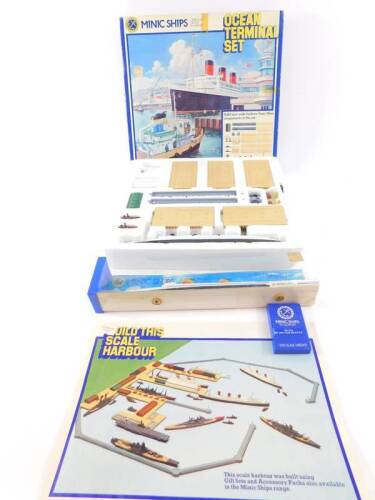 A Hornby Minic Ships die-cast model of an ocean terminal set, including the RMS Queen Mary, scale 1:1200,. together with a model of the SS United States, both boxed. (2)