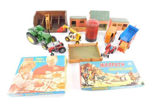 An Ertl model of a John Deere tractor, further farm vehicles, farm buildings, a Merit Dial & Spell, Thorne's Post Office box money box and a World stamp album. (qty)