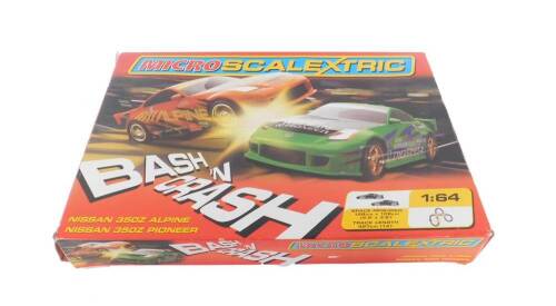 A Micro Scalectrix, scale 1:64 containing a Nissan 350Z Alpine and a Nissan 350Z Pioneer, boxed