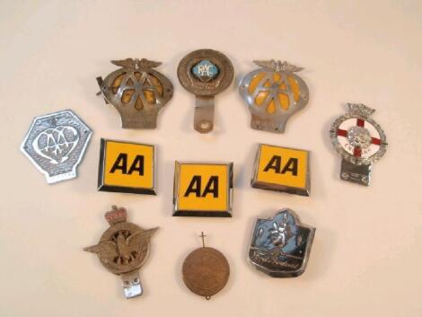 A selection of old AA and RAC car badges