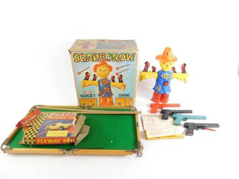 An Ideal Scarecrow target game, boxed, Lonestar Flyers Flyway Set, boxed, and a miniature pool set.(3)