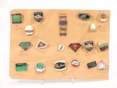 A selection of enamel badges for motorcycling