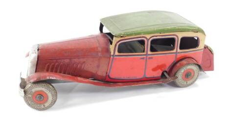 An English tin plate clockwork model of a Citroen Rosalie, circa 1934, with Dunlop 90 tyres, 28cm L.