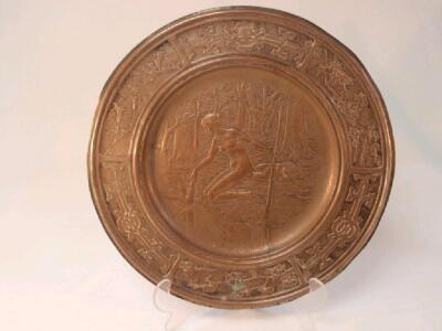 An Arts & Crafts silvered copper charger inscribed SHAKESPEARES SONNET