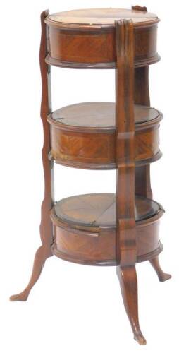 A 19thC French rosewood and kingwood three tier etagere, with three circular compartments, each with a hinged lid, a moulded edge on shaped supports with splayed legs and stylised foot shaped feet, (AF) 82cm H, the top 32cm diameter.