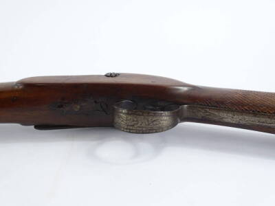 A late 19thC muzzle loading shotgun, with single barrel, ram rod and partly engraved plate (no maker) and walnut stock, 120cm L. - 5