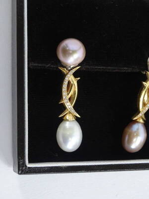 A pair of 18ct gold South Sea pearl set drop earrings, the top pink coloured pearl, set in white metal setting, with an 18ct gold drop, set with tiny diamonds with makers stamp S.W, and a white design pearl drop, the other earring the pearls are the oppos - 2